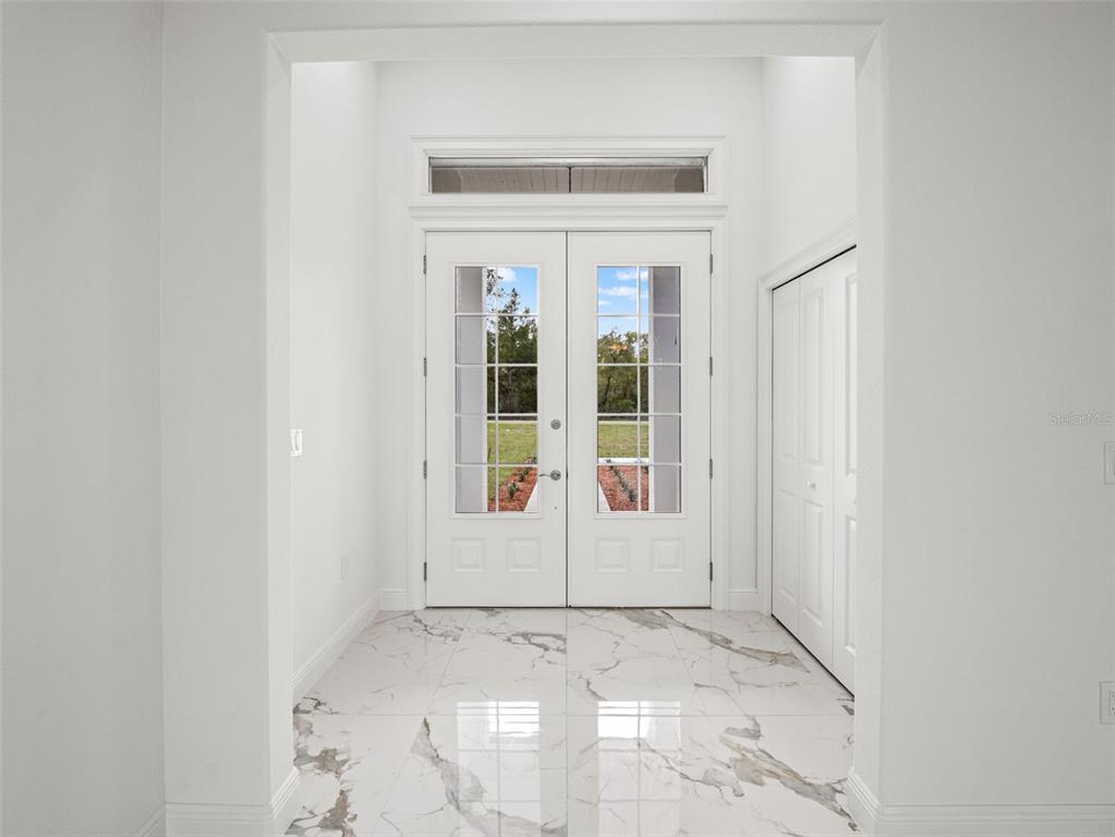 42430 Fir Street Eustis, FL 32736 - Photo 4 of 44 an empty room with windows
