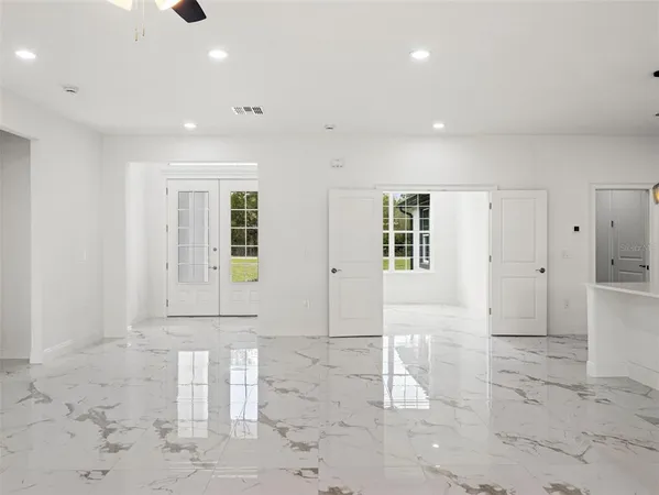 a view of a hallway with white walls