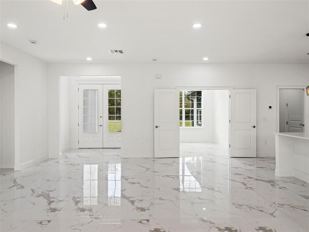 42430 Fir Street Eustis, FL 32736 - Photo 5 of 44 a view of a hallway with white walls