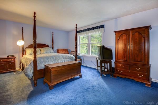 5 Garrison Road Shirley, MA 01464 - Photo 11 of 29 a living room with a bed and furniture