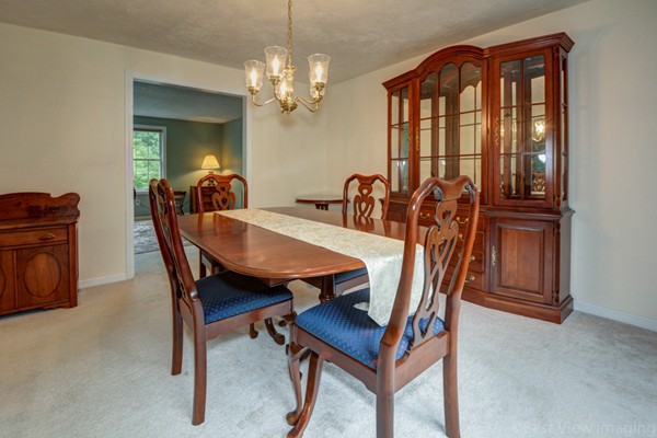 5 Garrison Road Shirley, MA 01464 - Photo 6 of 29 a view of a dining room with furniture and chandelier