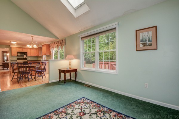 5 Garrison Road Shirley, MA 01464 - Photo 10 of 29 a living room with a dining table and a rug
