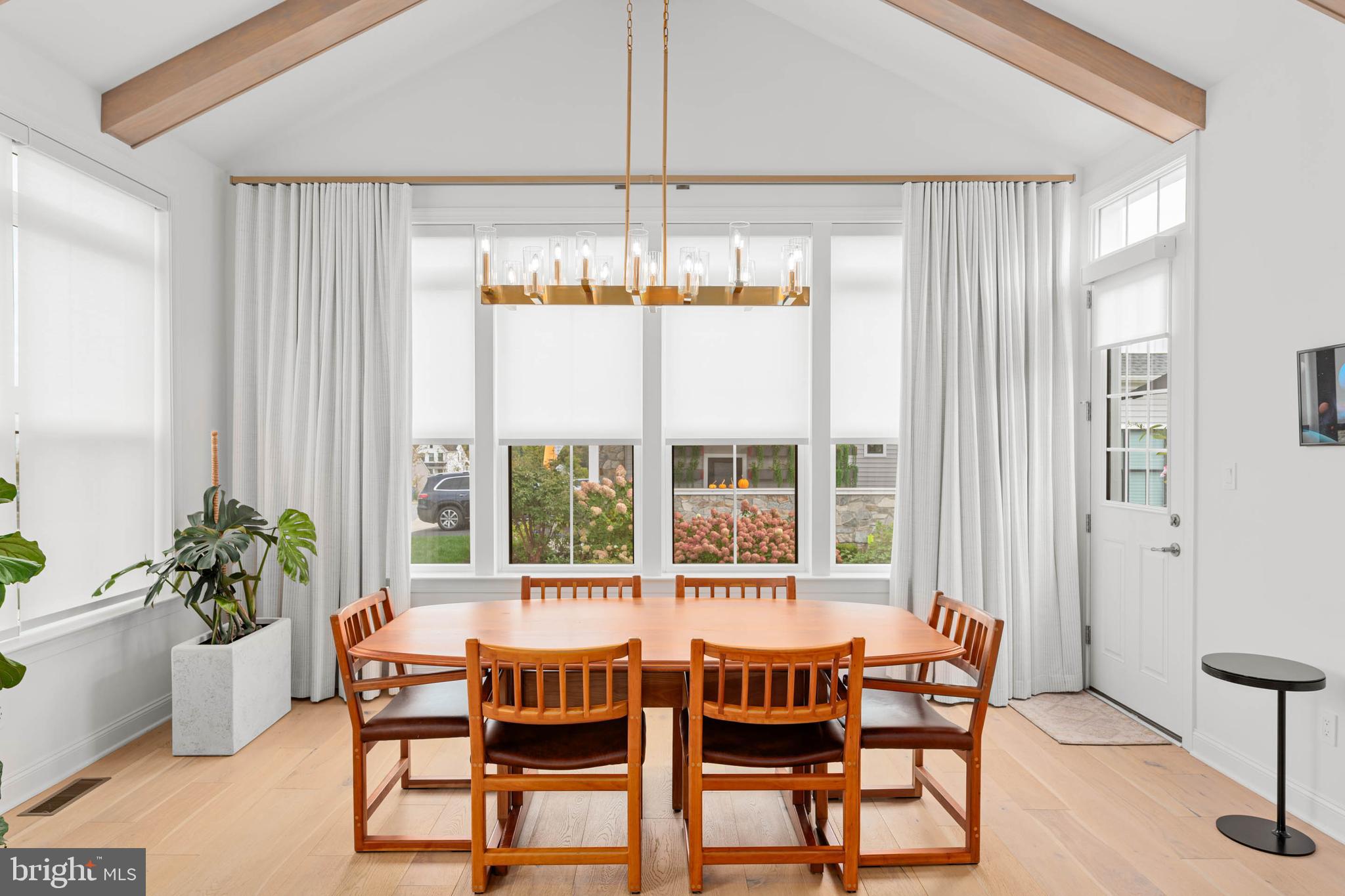 142 Preakness Way Downingtown, PA 19335 - Photo 15 of 56 a dining room with furniture a chandelier and wooden floor