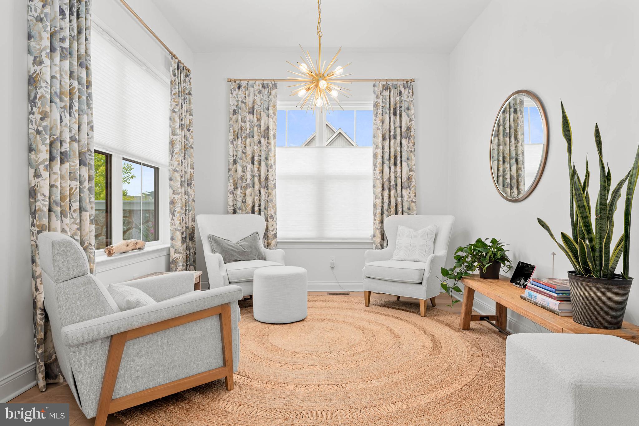 142 Preakness Way Downingtown, PA 19335 - Photo 16 of 56 a living room with furniture a chandelier and a large mirror