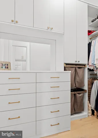 a bathroom with a double vanity sink mirror and shower