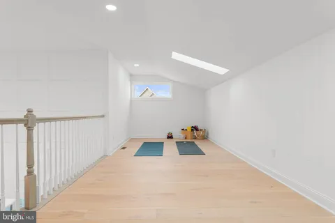 a living room with furniture a window and a lamp