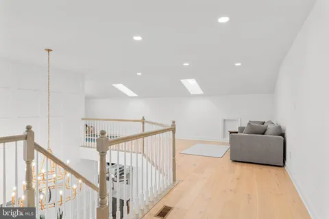 a bedroom with a bed and a chair