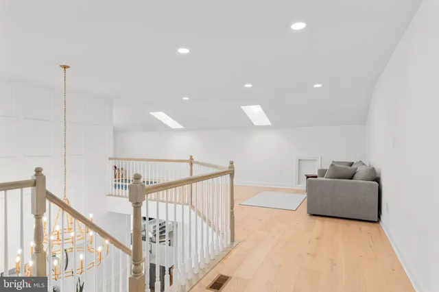 a bedroom with a bed and a chair