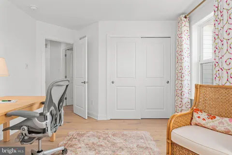 a view of a chair and table in the patio with a potted plant