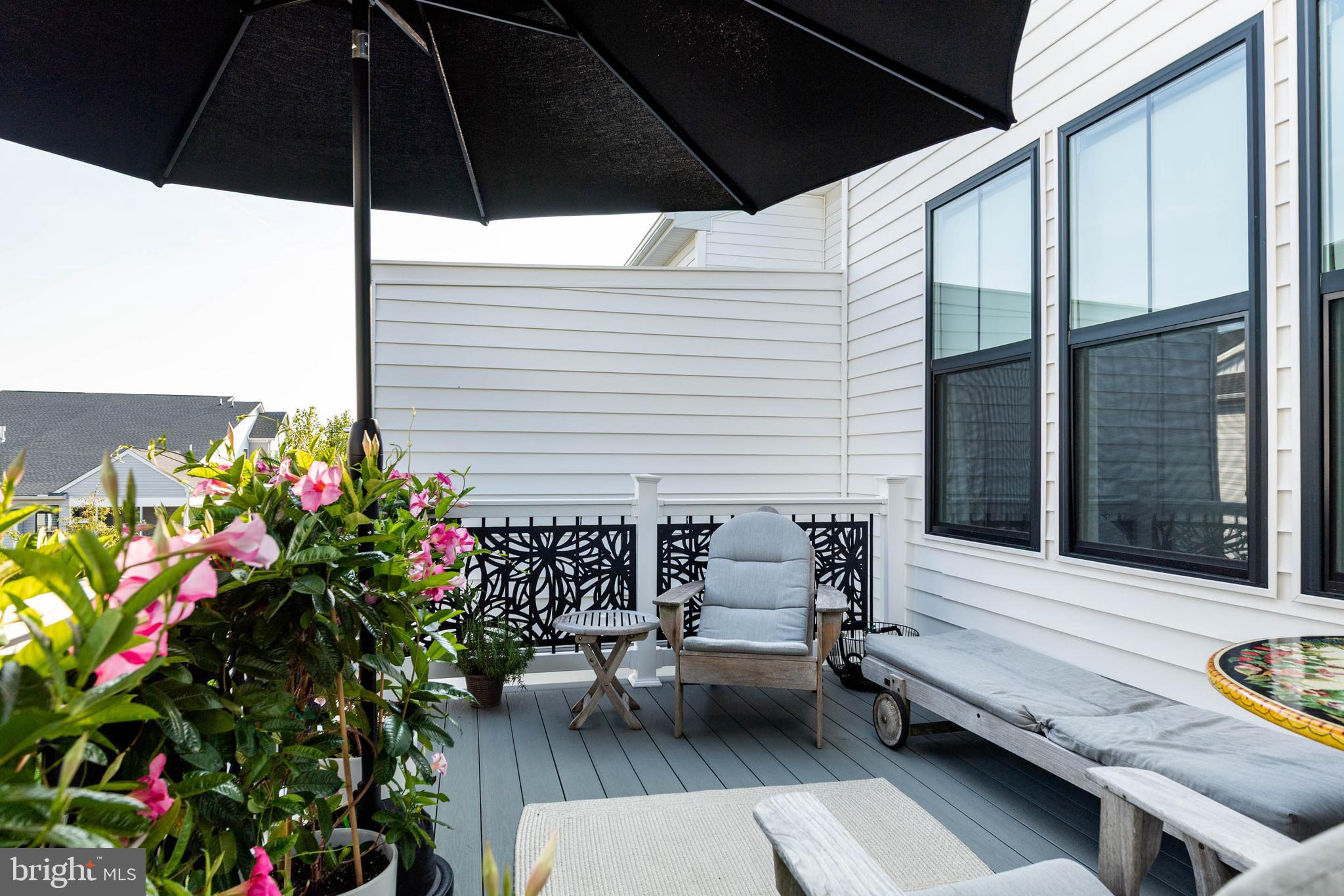142 Preakness Way Downingtown, PA 19335 - Photo 39 of 56 a balcony with potted plants and a bench