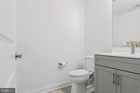 a living room with fireplace furniture and a chandelier