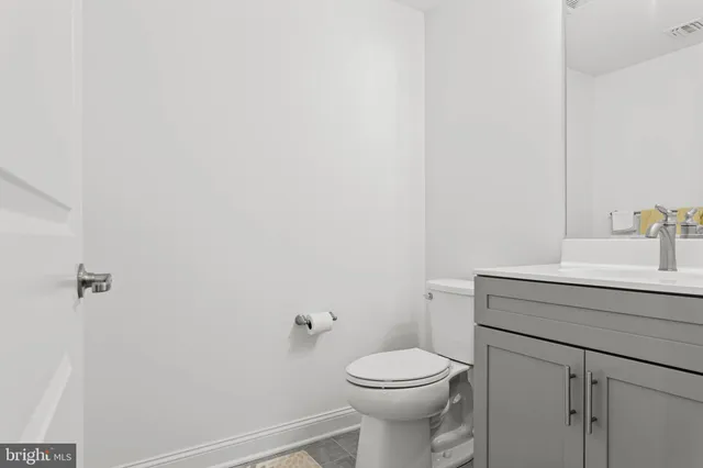 a living room with fireplace furniture and a chandelier