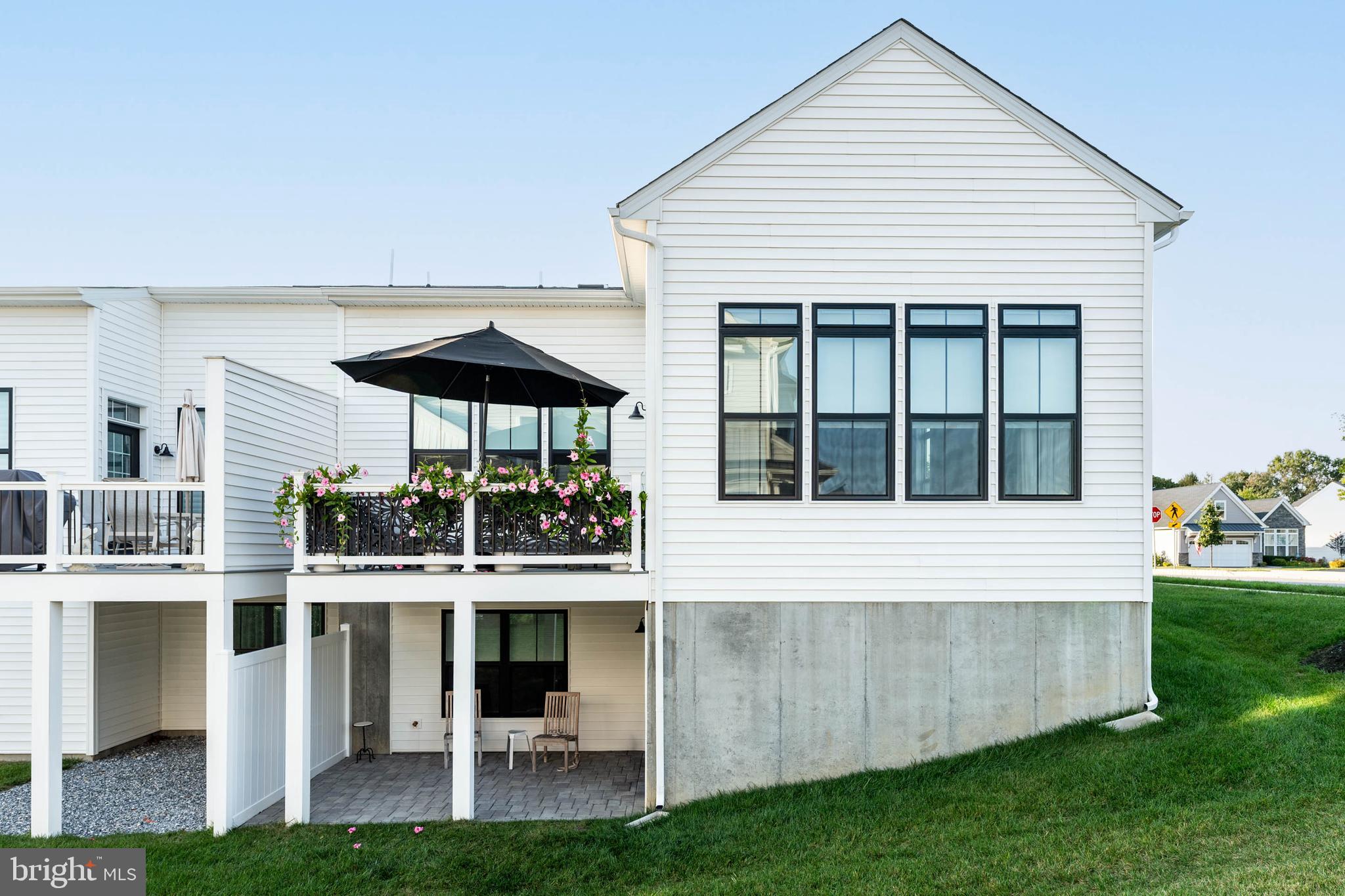 142 Preakness Way Downingtown, PA 19335 - Photo 44 of 56 a front view of a house with a garden and porch