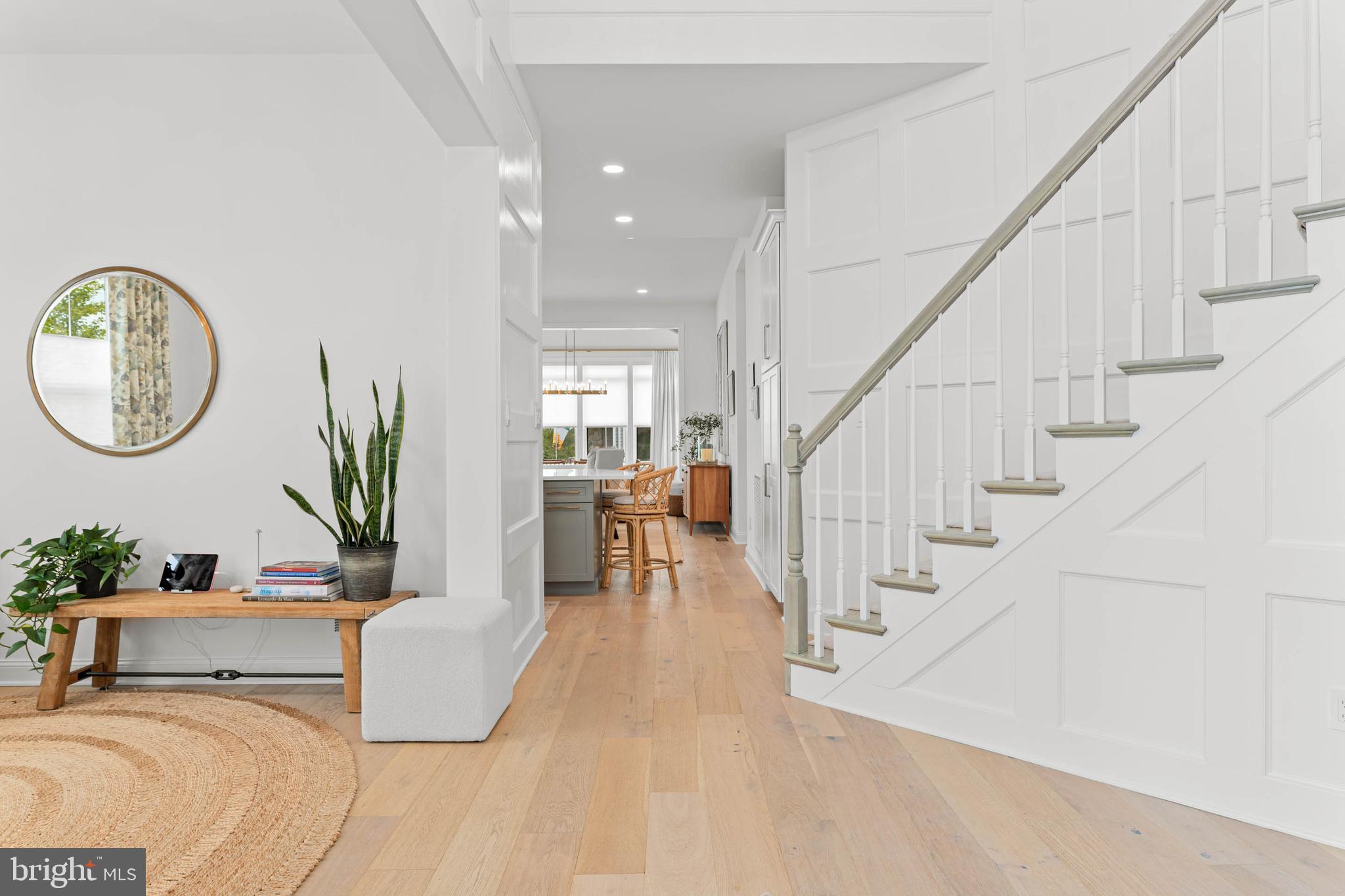 142 Preakness Way Downingtown, PA 19335 - Photo 5 of 56 a living room with couches chairs and a large mirror with wooden floor