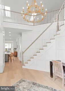 a view of entryway and hall with dining room