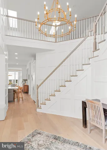 a view of entryway and hall with dining room