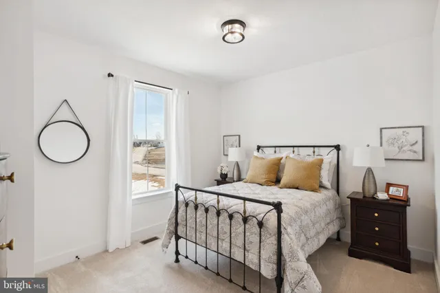 a bedroom with a bed and a closet