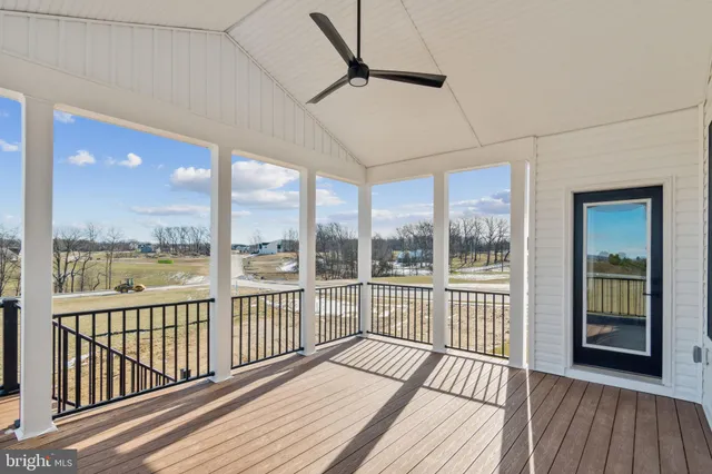 a view of a balcony with wooden floor