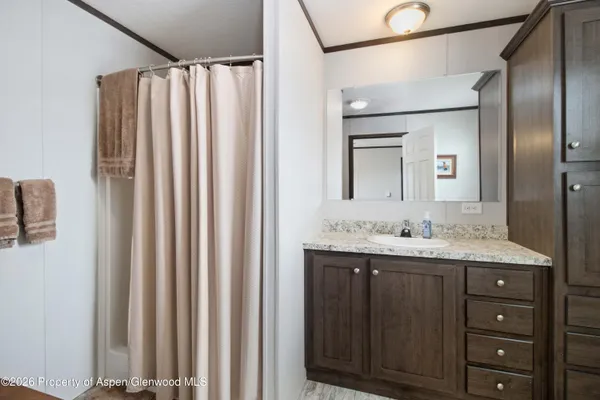 a bathroom with a double vanity sink and mirror