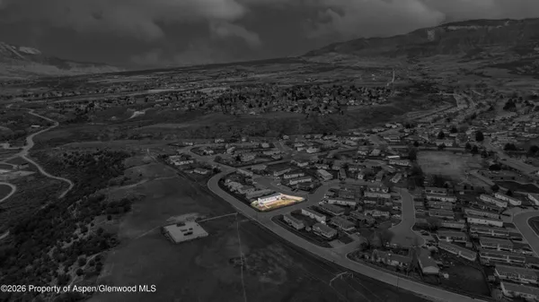 an aerial view of a residential house