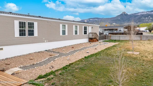 a house view with a backyard space