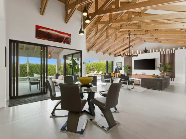 a spacious bathroom with a glass shower door and a bathtub