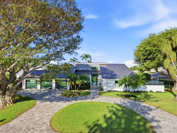 an aerial view of a house swimming pool and outdoor seating