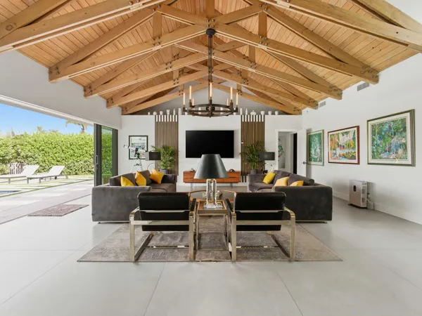 a view of a livingroom with furniture and front door