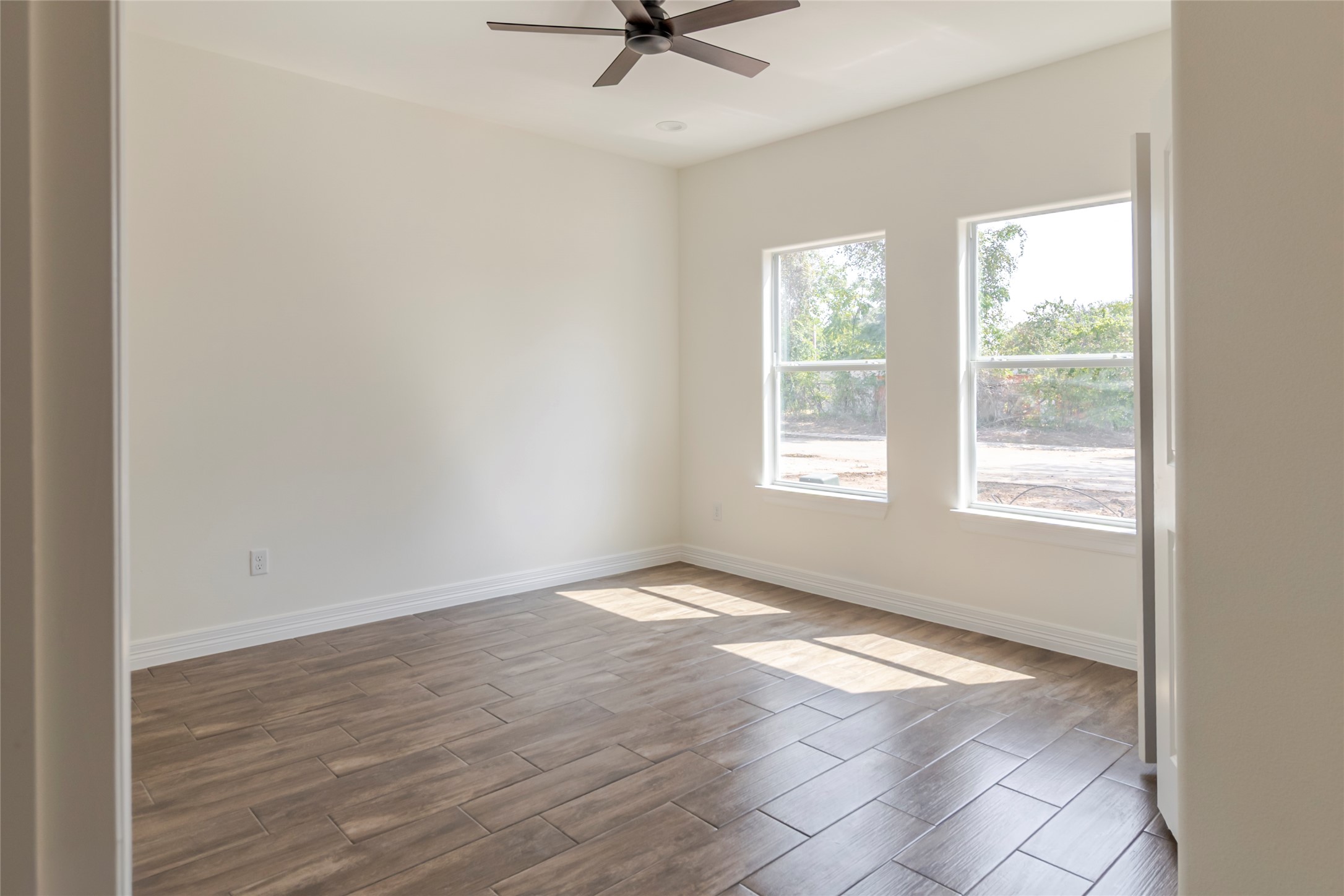 309 Myrtle Road Smithville, TX 78957 - Photo 15 of 17 Bedroom three gets two windows and extra daylight, whether it stays a bedroom or clocks in as the home office.