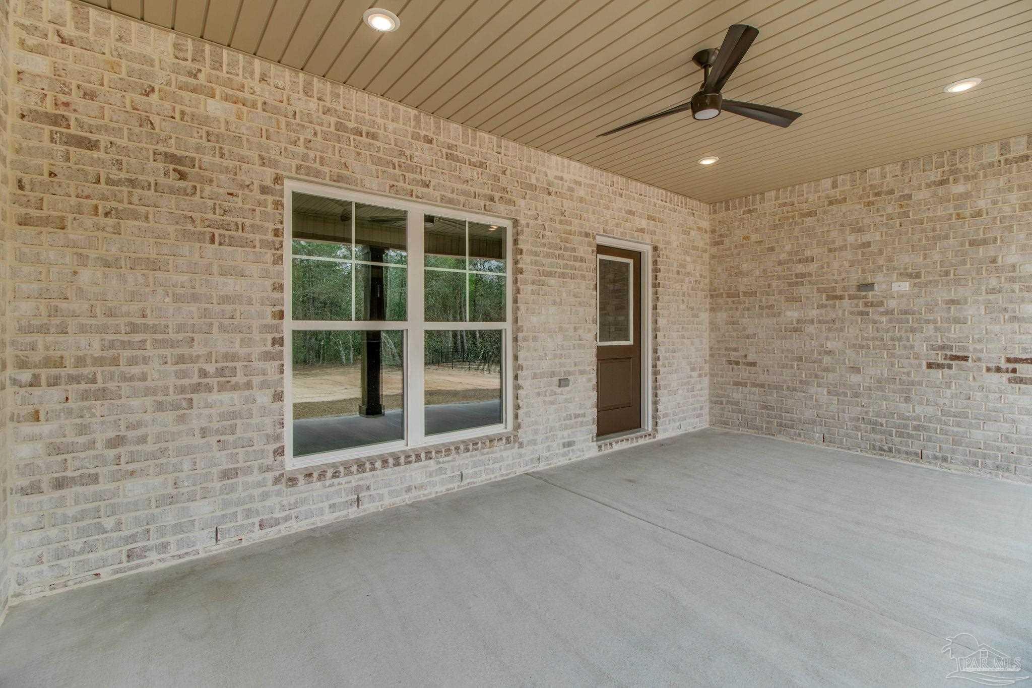 4310 Watkins Street Pace, FL 32571 - Photo 8 of 58 a view of an empty room with a fireplace