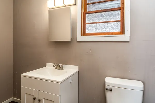a kitchen with a stove a sink and a refrigerator