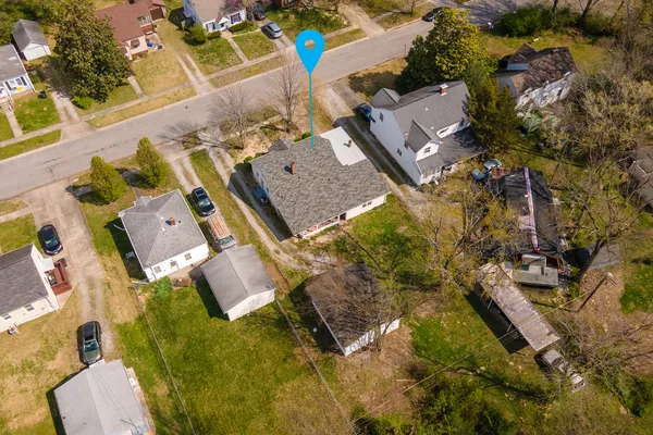 an aerial view of residential house with swimming pool