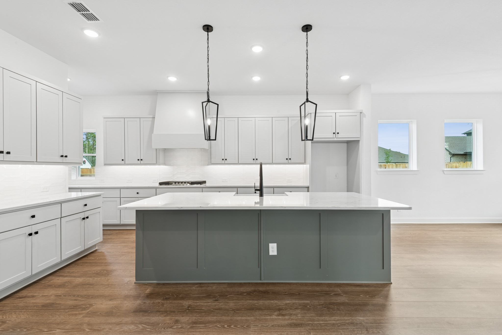 15714 Terracotta Terrace Lane Conroe, TX 77302 - Photo 27 of 47 a kitchen with kitchen island a sink stainless steel appliances and cabinets