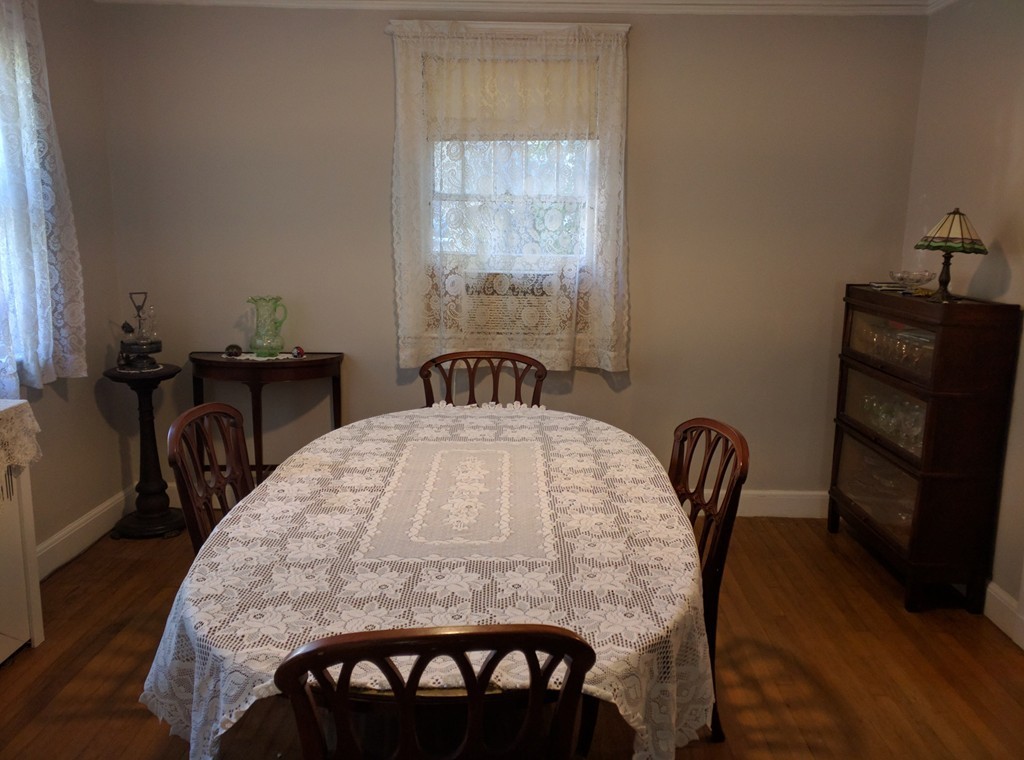 43 Blake Road Brookline, MA 02445 - Photo 3 of 7 a view of a dining room with furniture and wooden floor