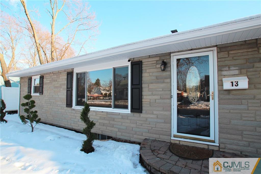 13 Racetrack Road East Brunswick, NJ 08816 - Photo 2 of 15 a house view with a outdoor space