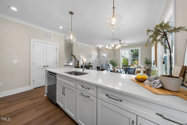 a spacious bathroom with double vanity and a mirror