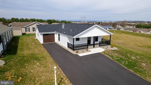 a aerial view of a house with a yard