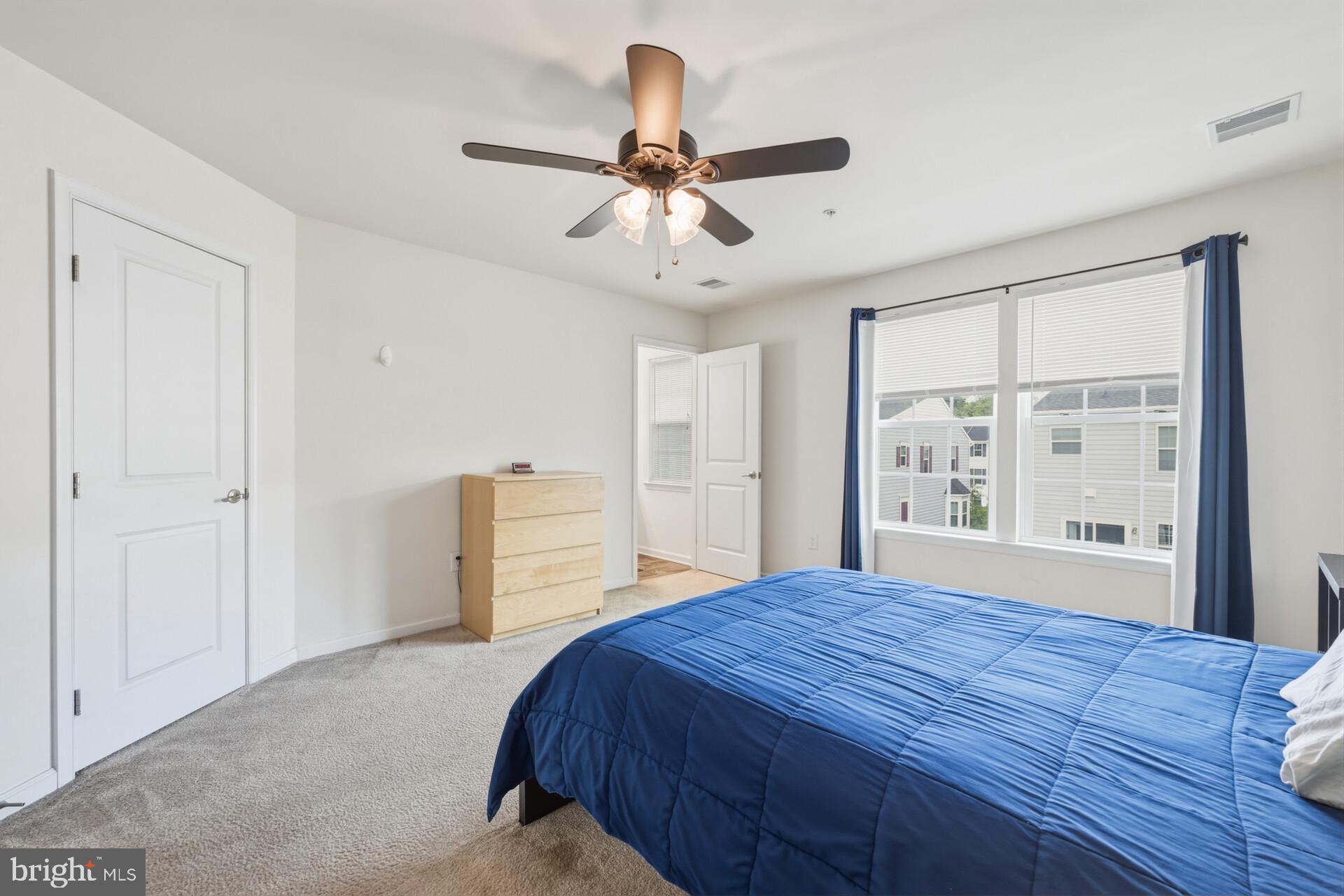 325 Schmidt Road Phoenixville, PA 19460 - Photo 25 of 27 a bedroom with a large bed and a chandelier