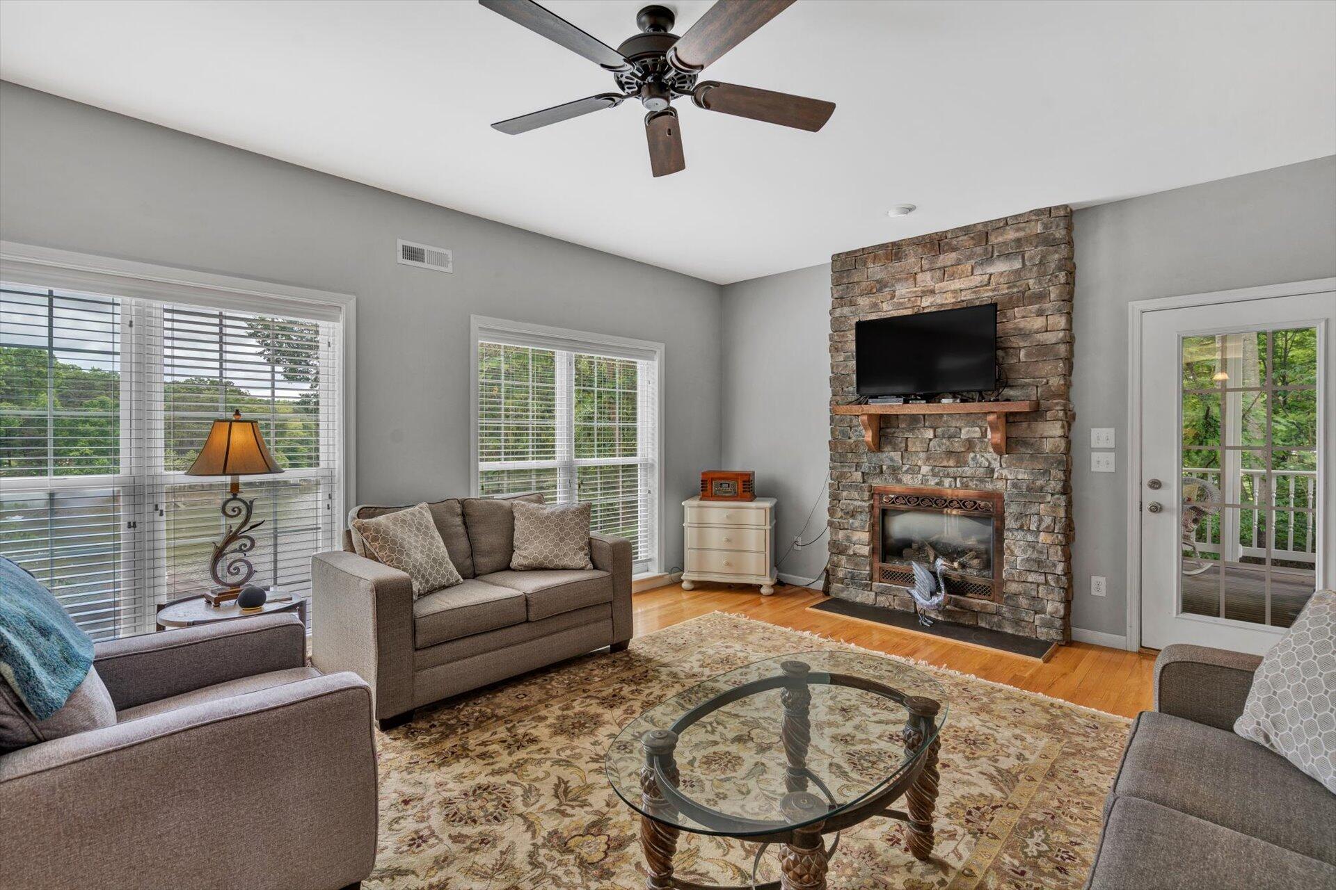 155 Cedar Bay Road Union Hall, VA 24176 - Photo 12 of 61 a living room with furniture a fireplace and a flat screen tv