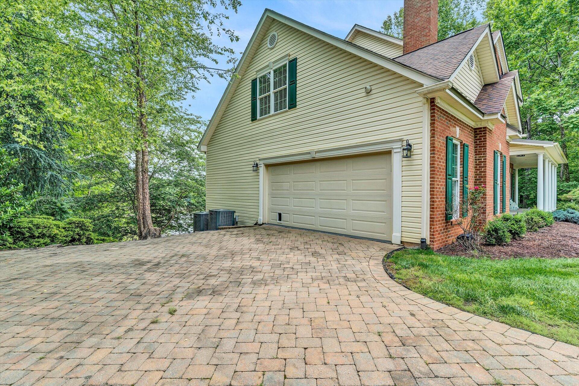 155 Cedar Bay Road Union Hall, VA 24176 - Photo 21 of 61 a front view of a house with a yard and garage