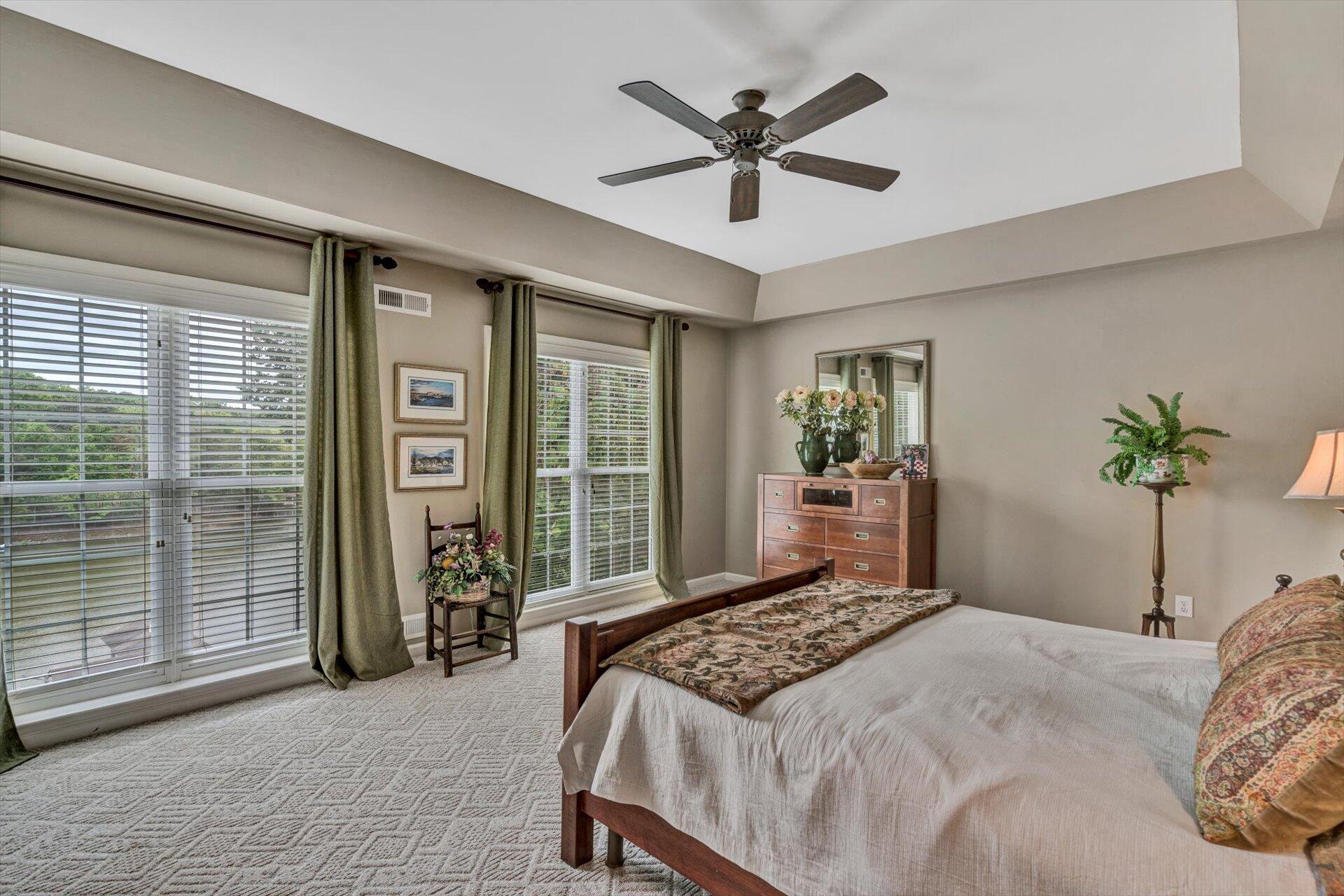 155 Cedar Bay Road Union Hall, VA 24176 - Photo 24 of 61 a bedroom with a large bed and a large window