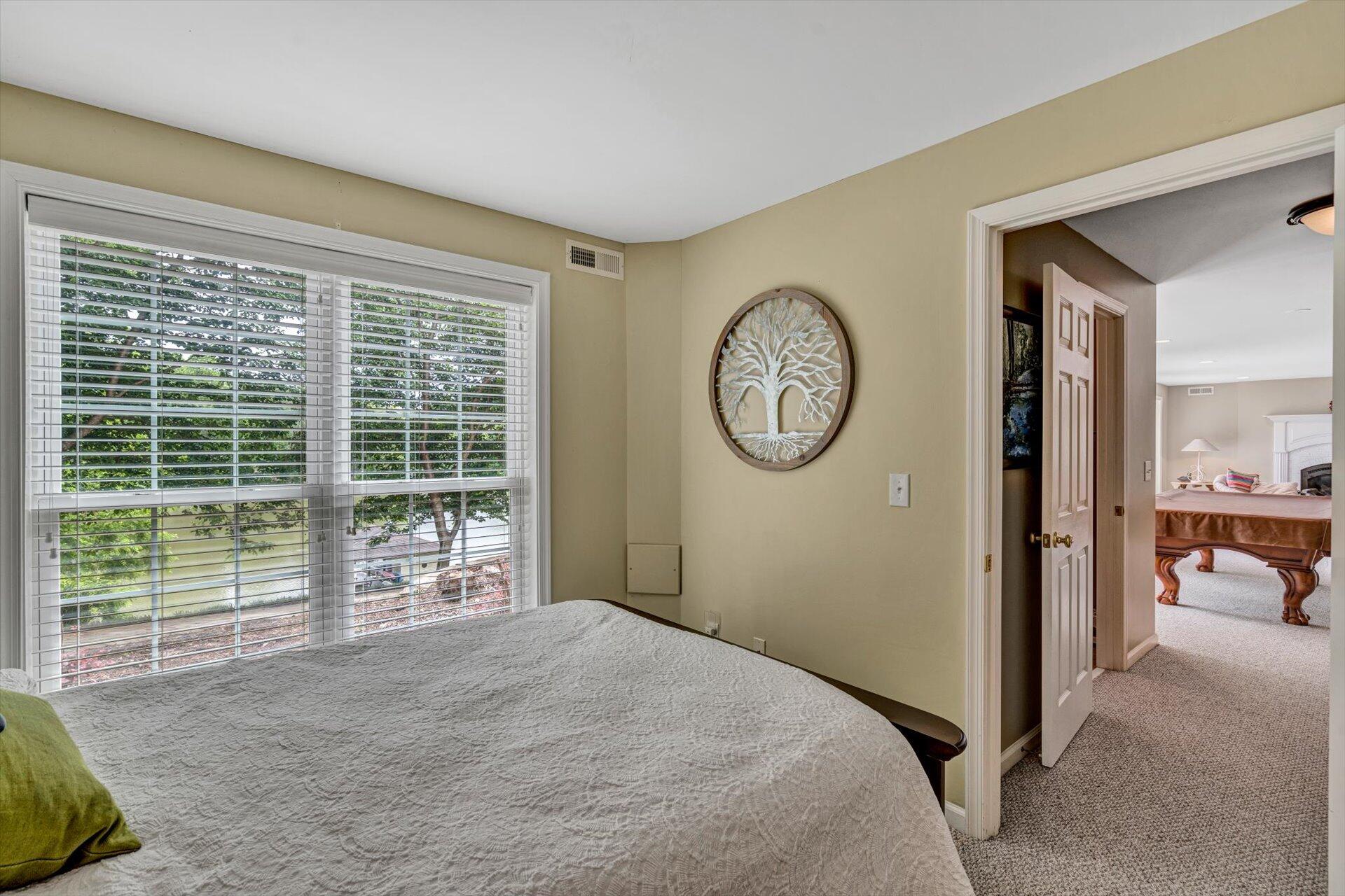 155 Cedar Bay Road Union Hall, VA 24176 - Photo 41 of 61 a bedroom with a large bed and a large window