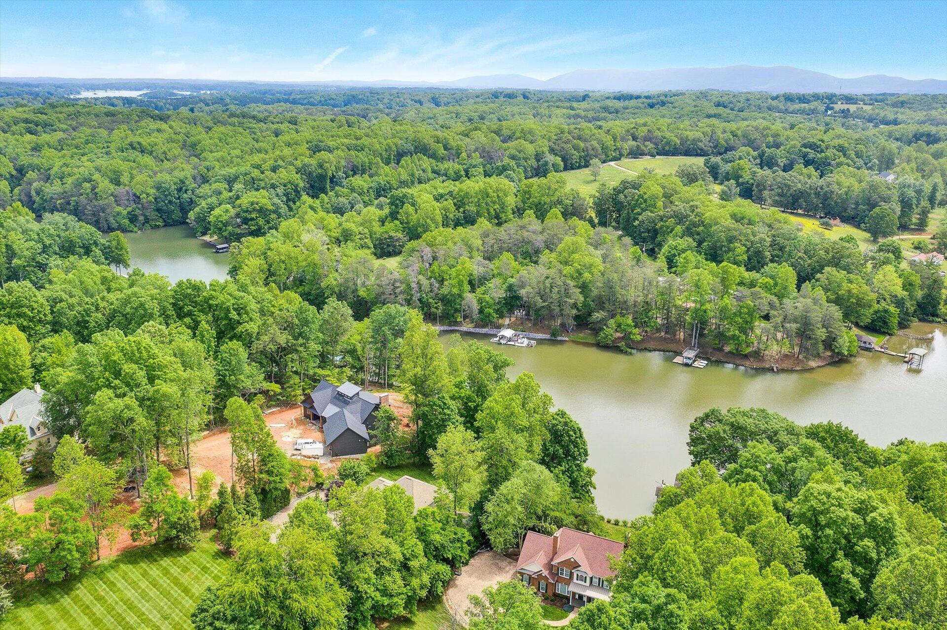 155 Cedar Bay Road Union Hall, VA 24176 - Photo 57 of 61 an aerial view of residential houses with outdoor space and lake view