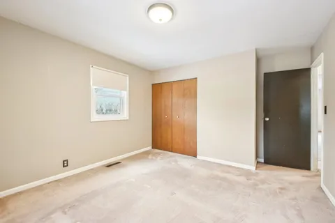 a view of a room with a wooden wall