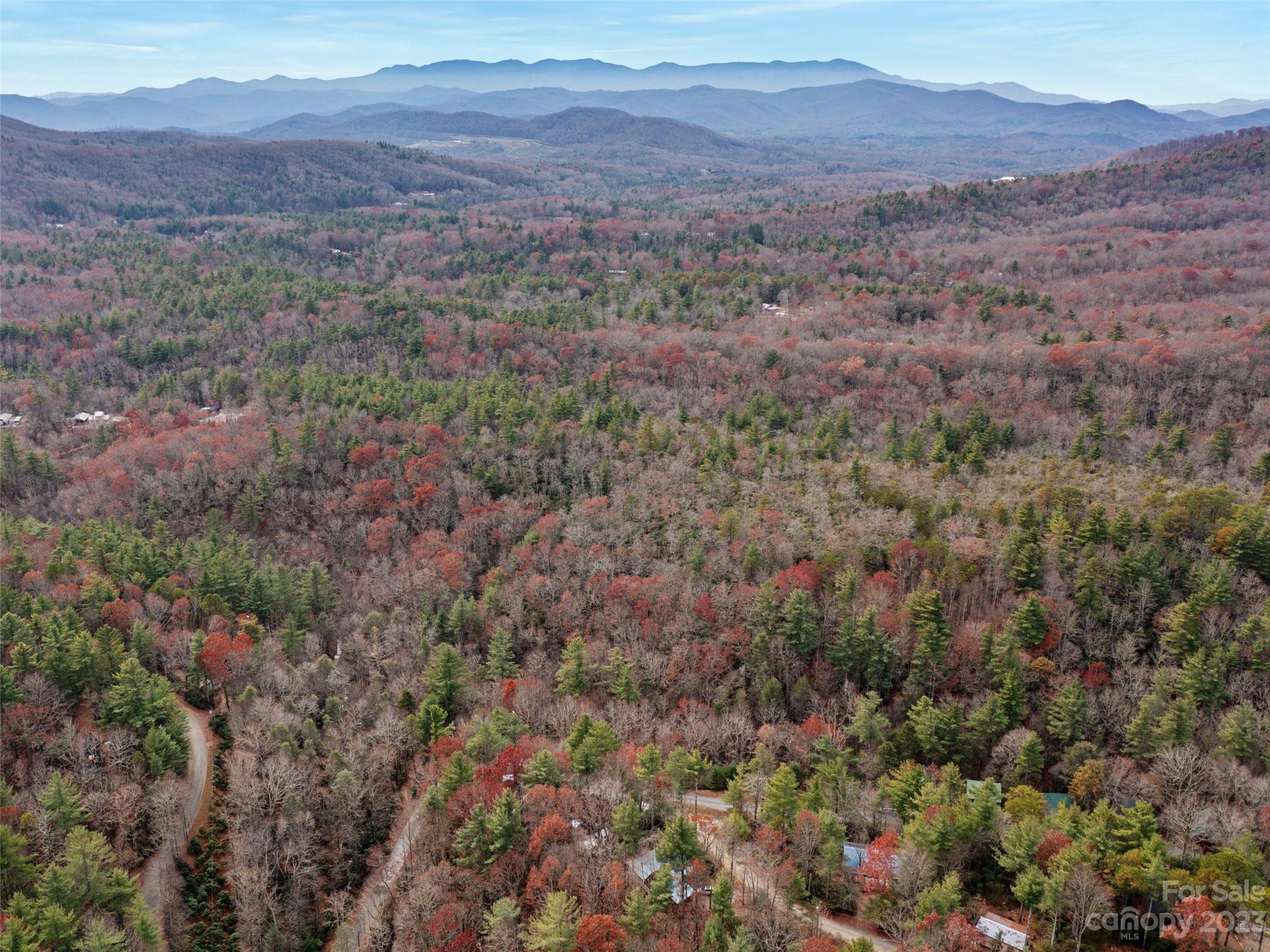 0 Creekside Loop, Unit 15 & 23 Spruce Pine, NC 28777 - Photo 9 of 28 a view of a lush green hillside and a houses