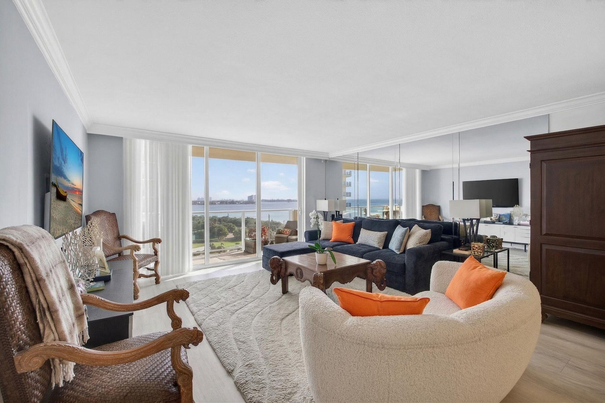 5440 North Ocean Drive, Unit 805 Singer Island, FL 33404 - Photo 2 of 56 a living room with furniture a large window and stainless steel appliances