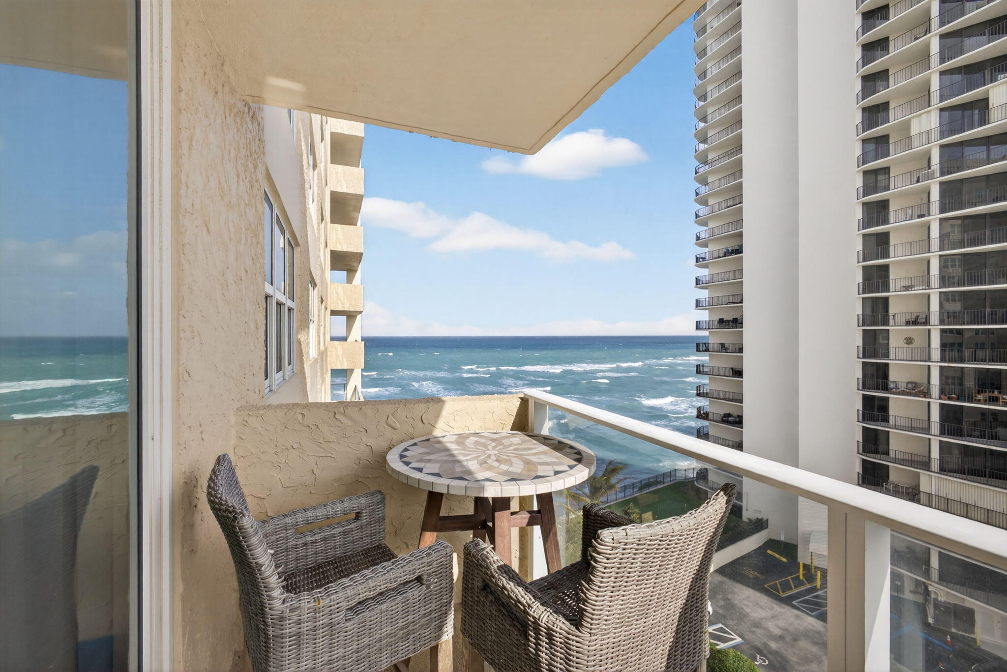 5440 North Ocean Drive, Unit 805 Singer Island, FL 33404 - Photo 21 of 56 a balcony with table and chairs