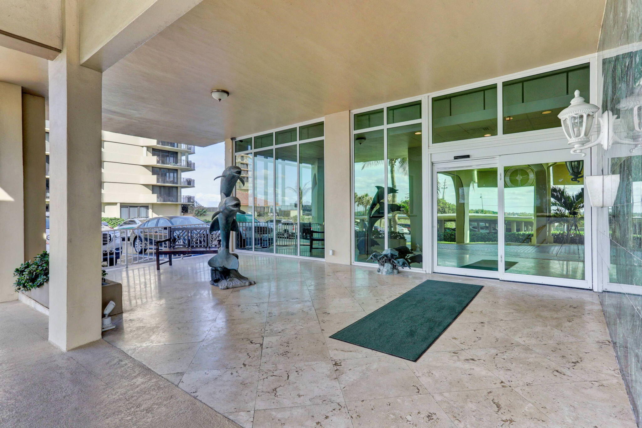 5440 North Ocean Drive, Unit 805 Singer Island, FL 33404 - Photo 27 of 56 a lobby with furniture and floor to ceiling window