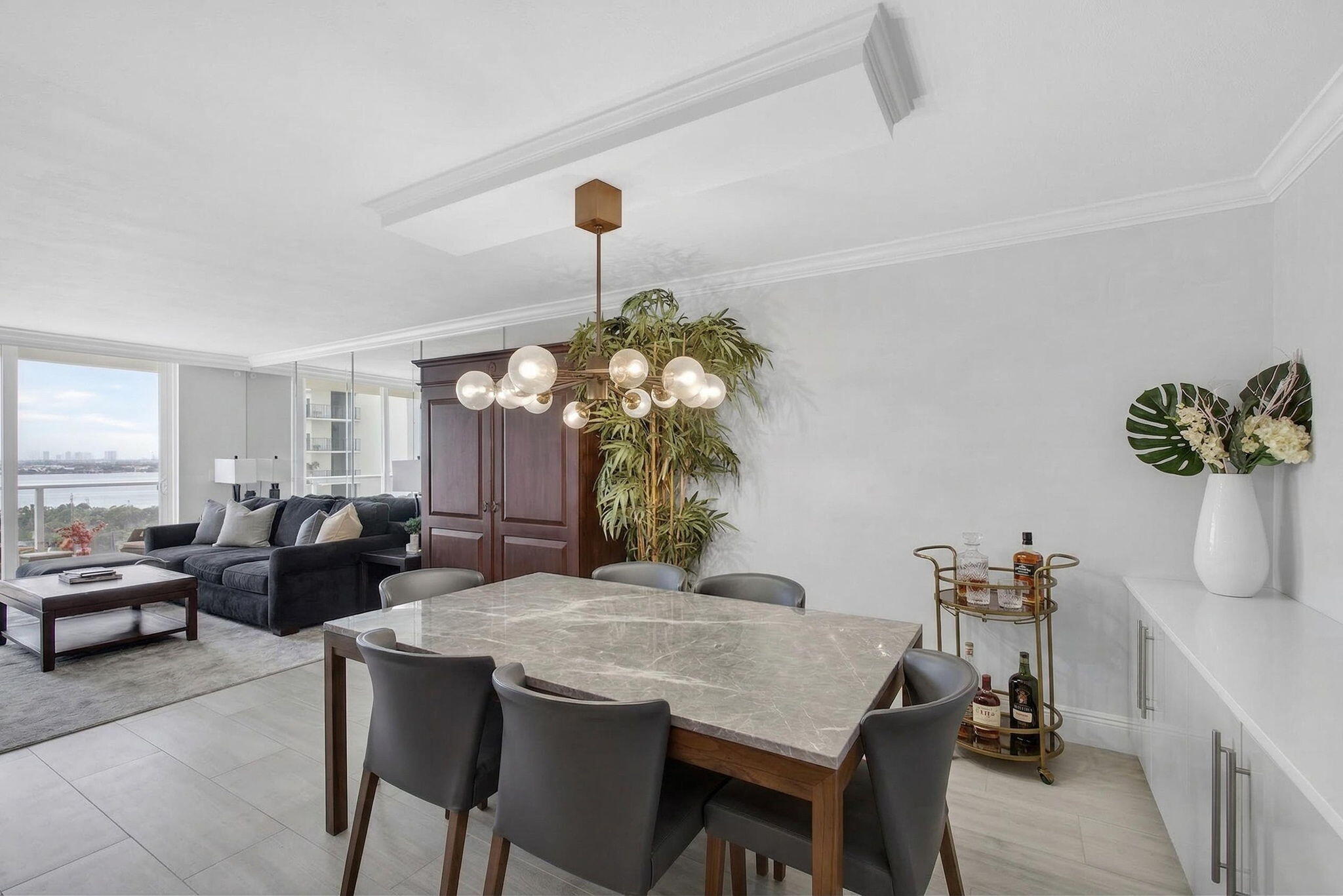 5440 North Ocean Drive, Unit 805 Singer Island, FL 33404 - Photo 4 of 56 a view of a dining room with furniture and wooden floor