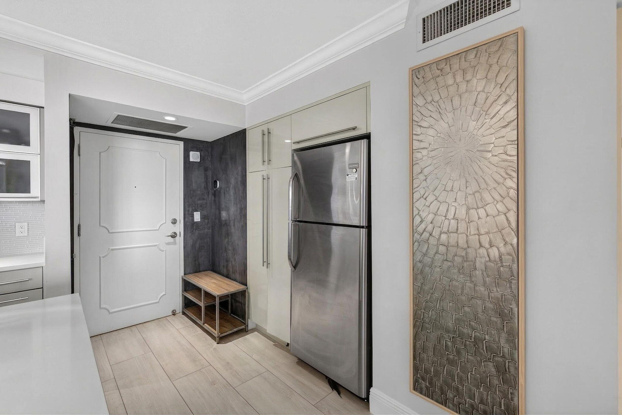 5440 North Ocean Drive, Unit 805 Singer Island, FL 33404 - Photo 6 of 56 a view of a hallway with closet and a livingroom